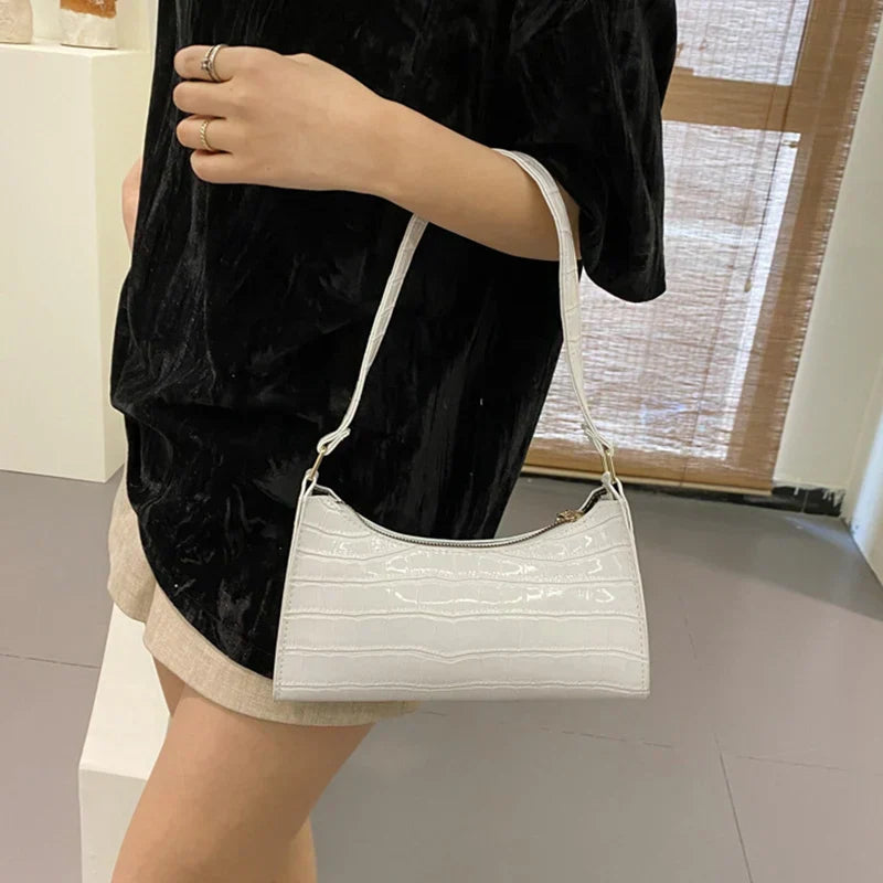 Maisie | Shiny shoulder bag with alligator pattern